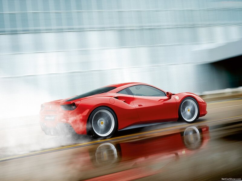 Red Ferrari Sports Car — Dynamic, Photograph, Road, Building