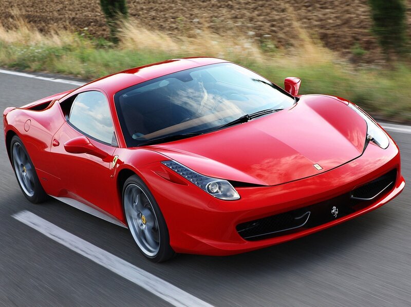 Red Ferrari sports car in motion