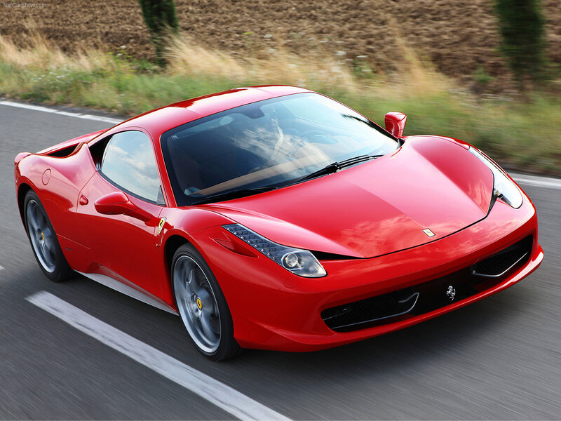 red ferrari sports car in motion