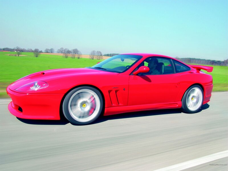 Red Ferrari sports car on road