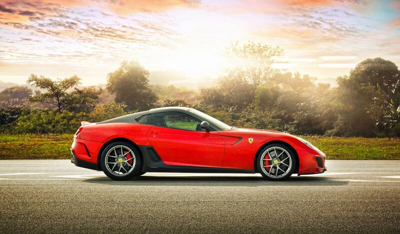 Red Ferrari sports car on road
