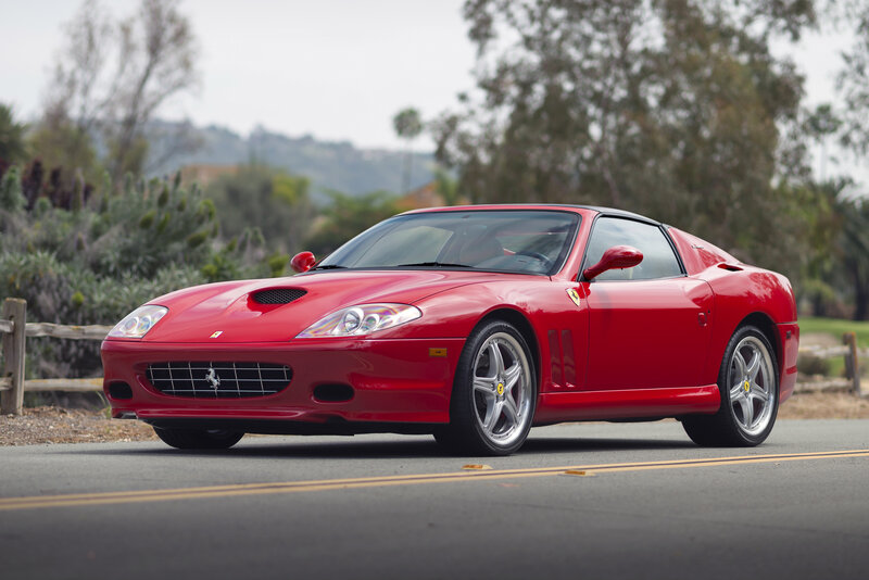 Red Ferrari sports car on road