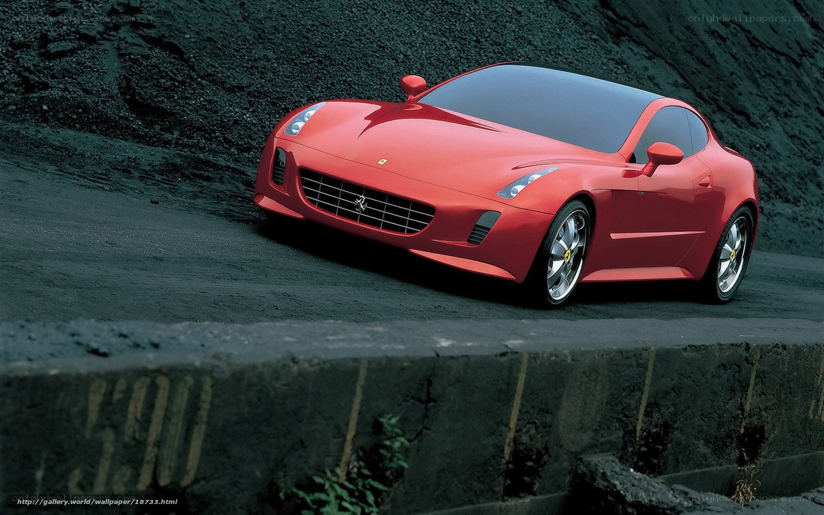 Red Ferrari sports car on road