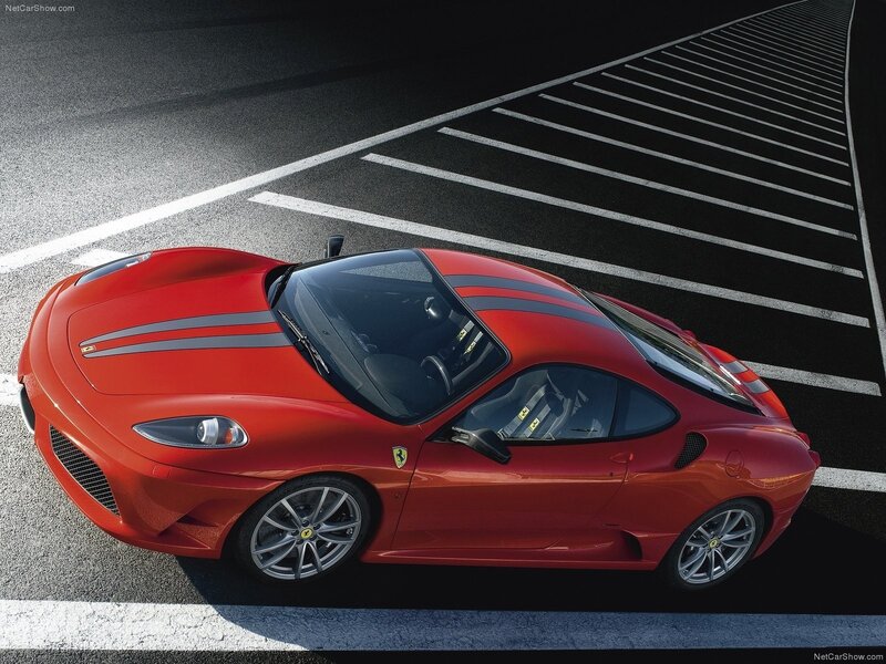 Red Ferrari sports car on track