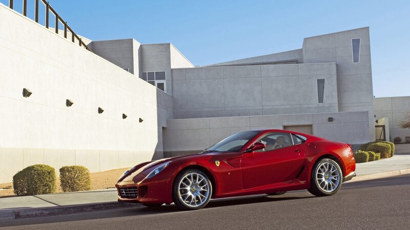 Red Ferrari sports car parked