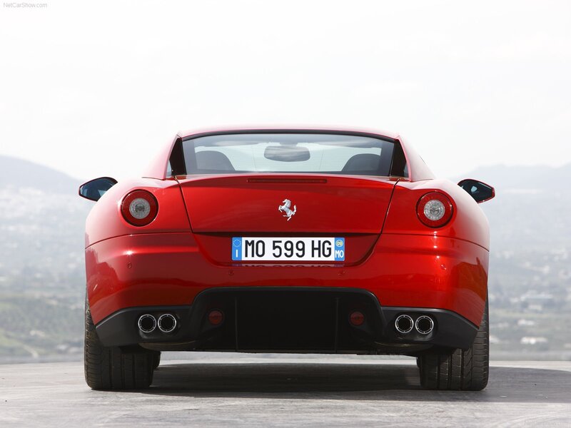 Red Ferrari sports car rear view