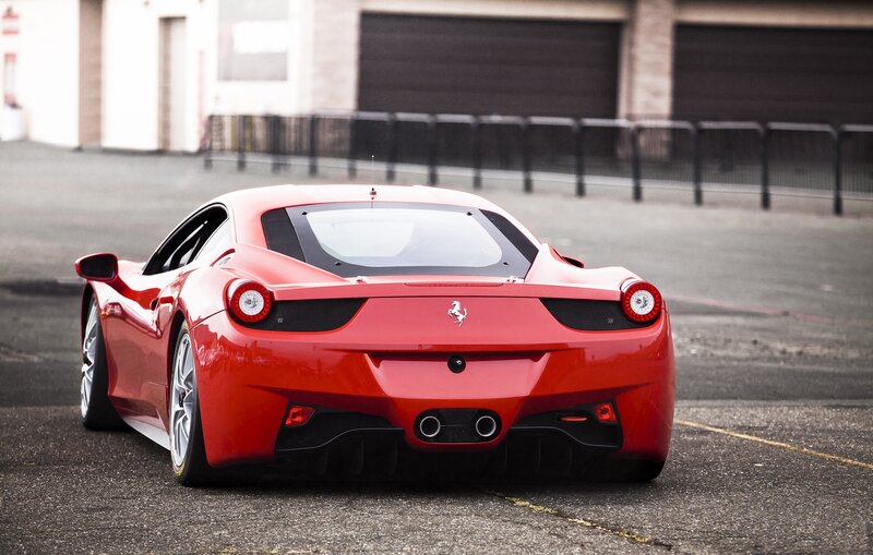 Red Ferrari sports car rear view