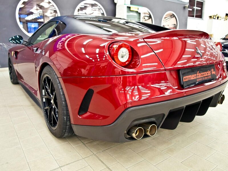 Red Ferrari sports car rear view