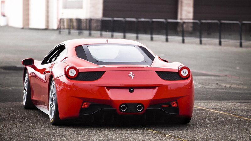 Red Ferrari sports car rear view