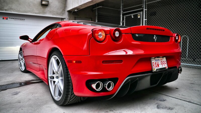 Red Ferrari sports car rear view
