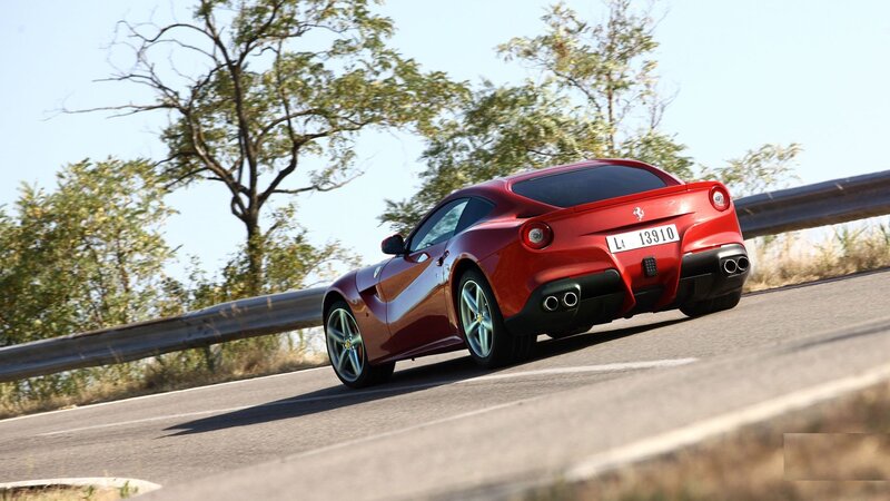 Red Ferrari Sports Car — Trees