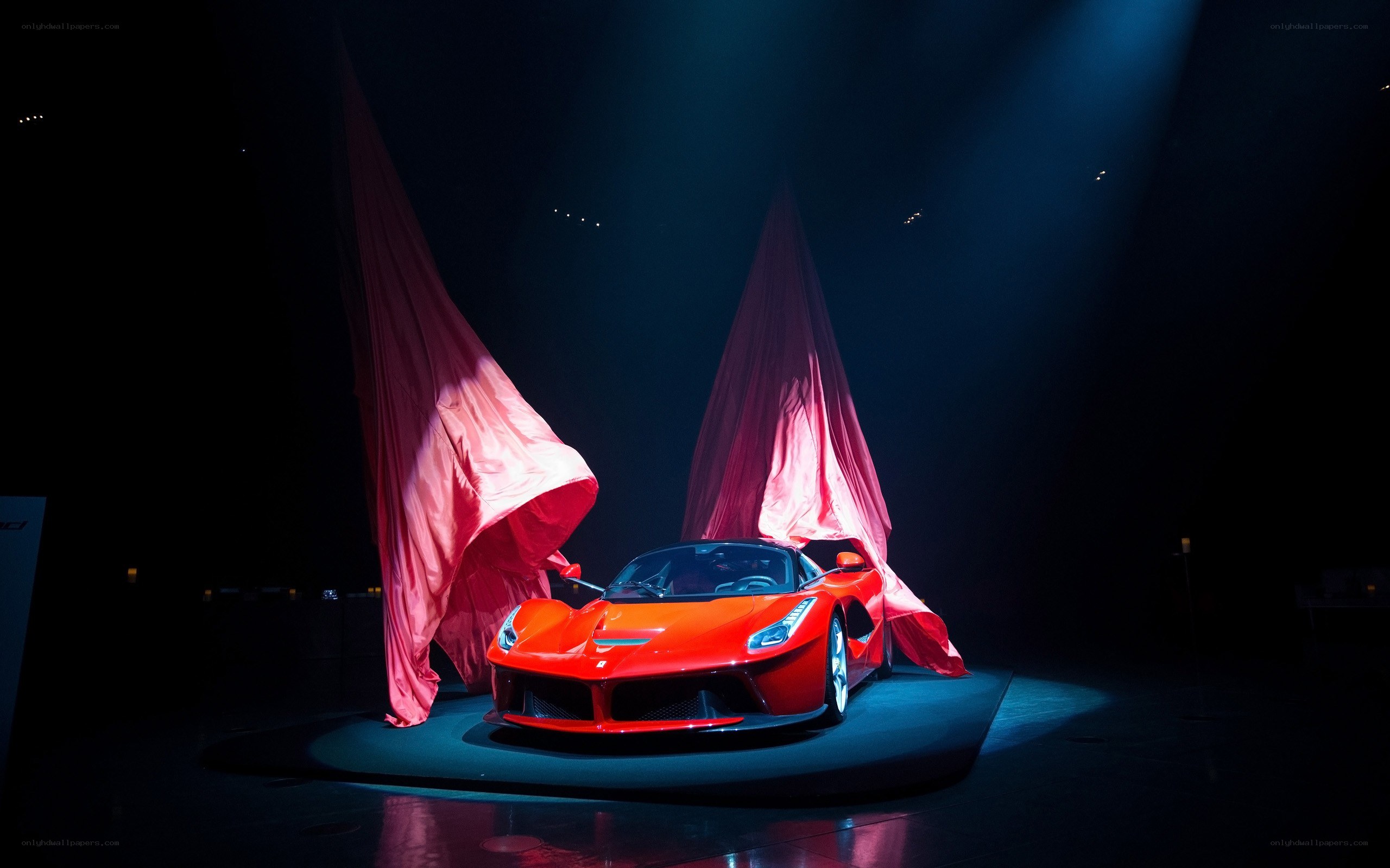 Red Ferrari unveiling on stage