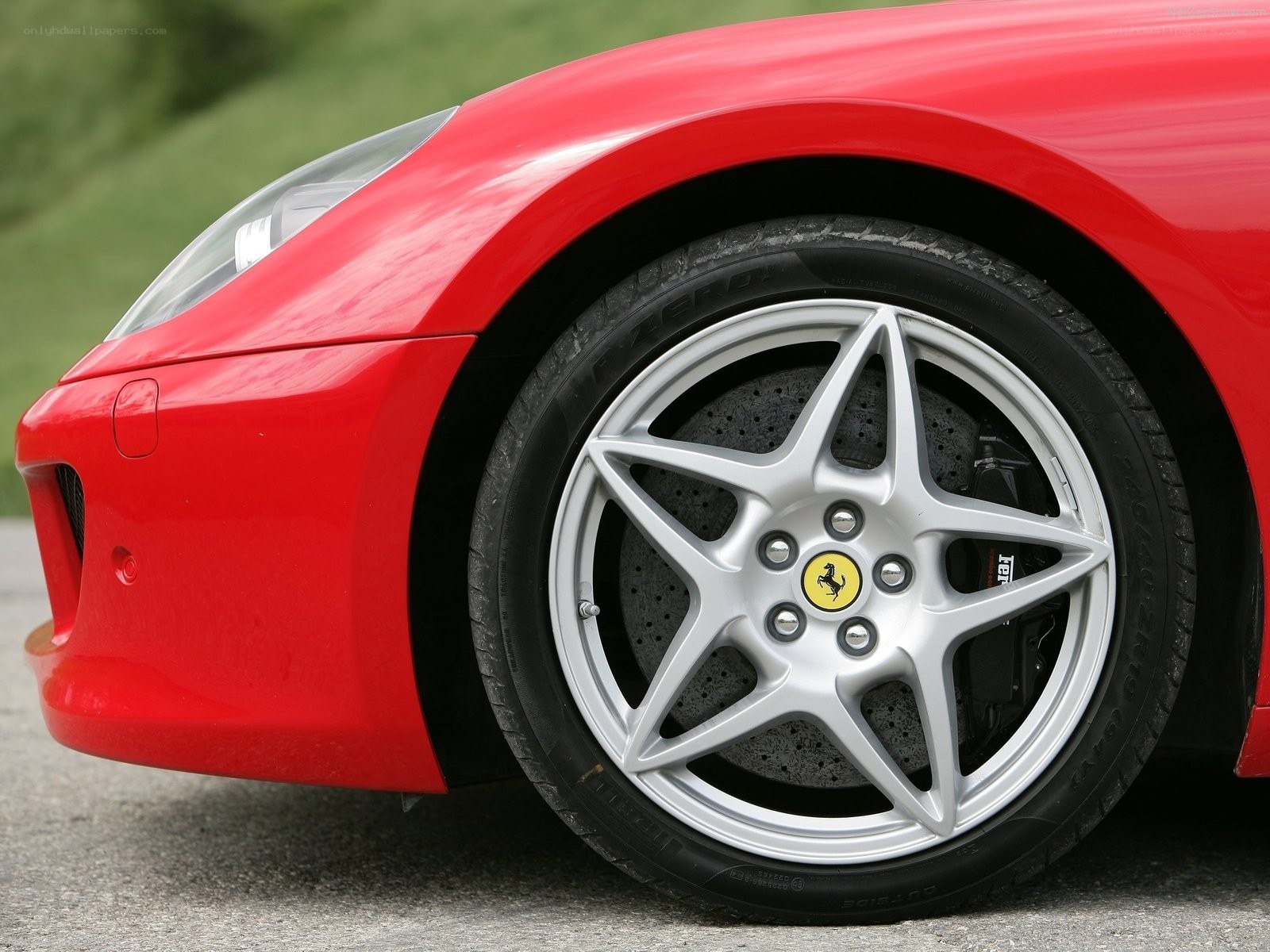 red ferrari wheel close-up