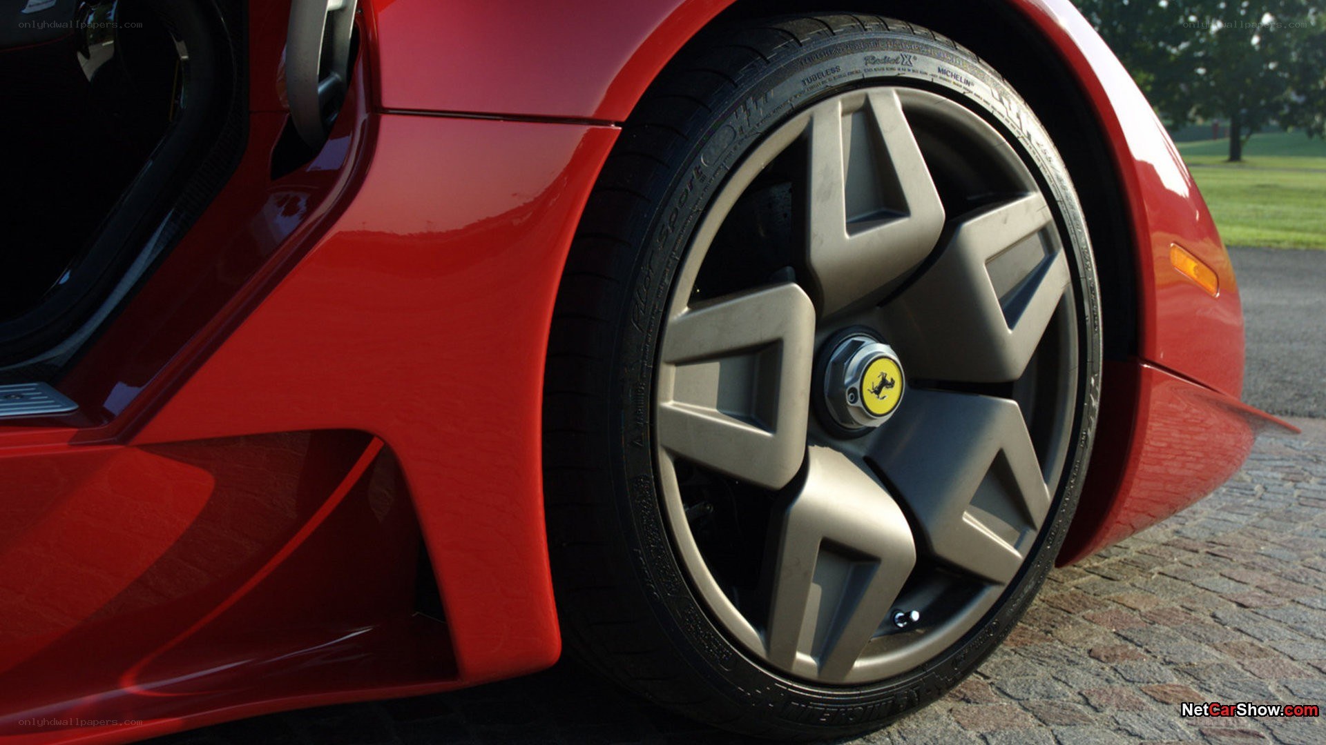 red ferrari wheel close-up