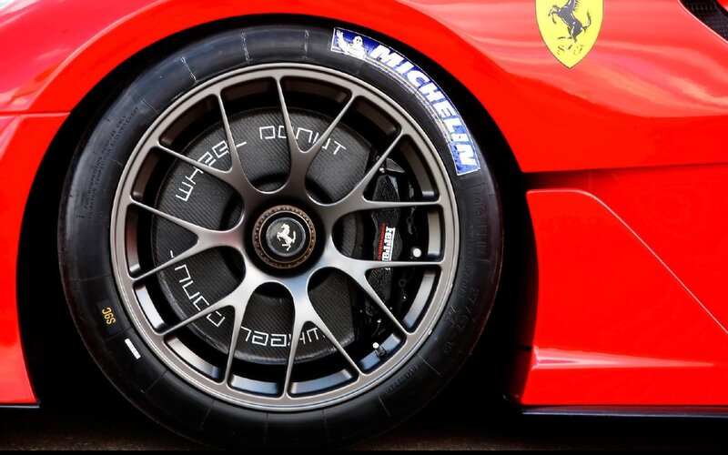 Red Ferrari Wheel — Dramatic, Photograph, Tire