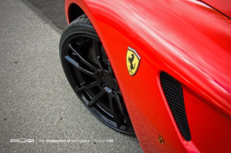 red ferrari with black wheels