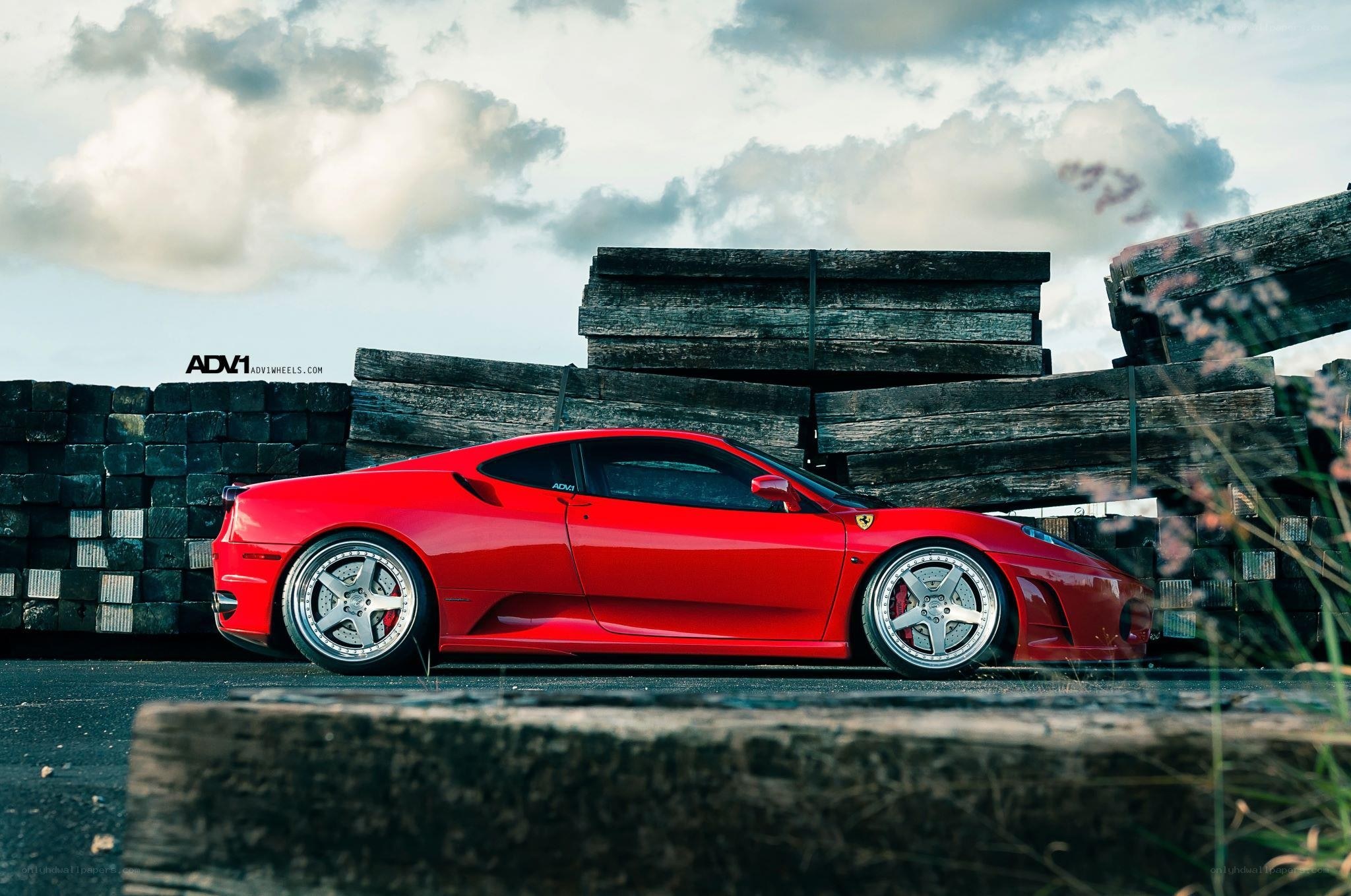 Red Ferrari with custom wheels
