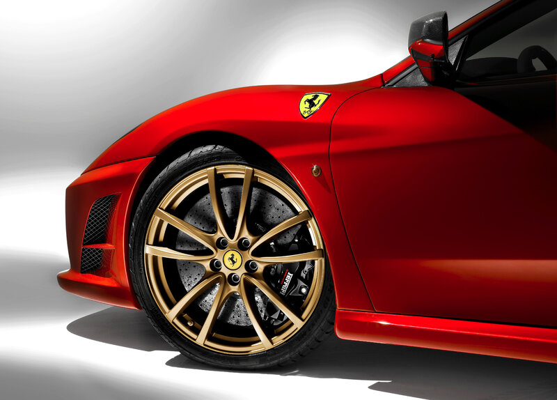 Red Ferrari with gold wheels