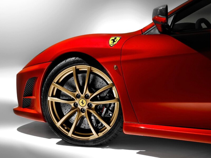 Red Ferrari with gold wheels