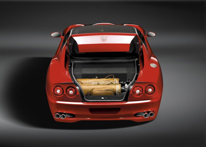 Red Ferrari with open trunk