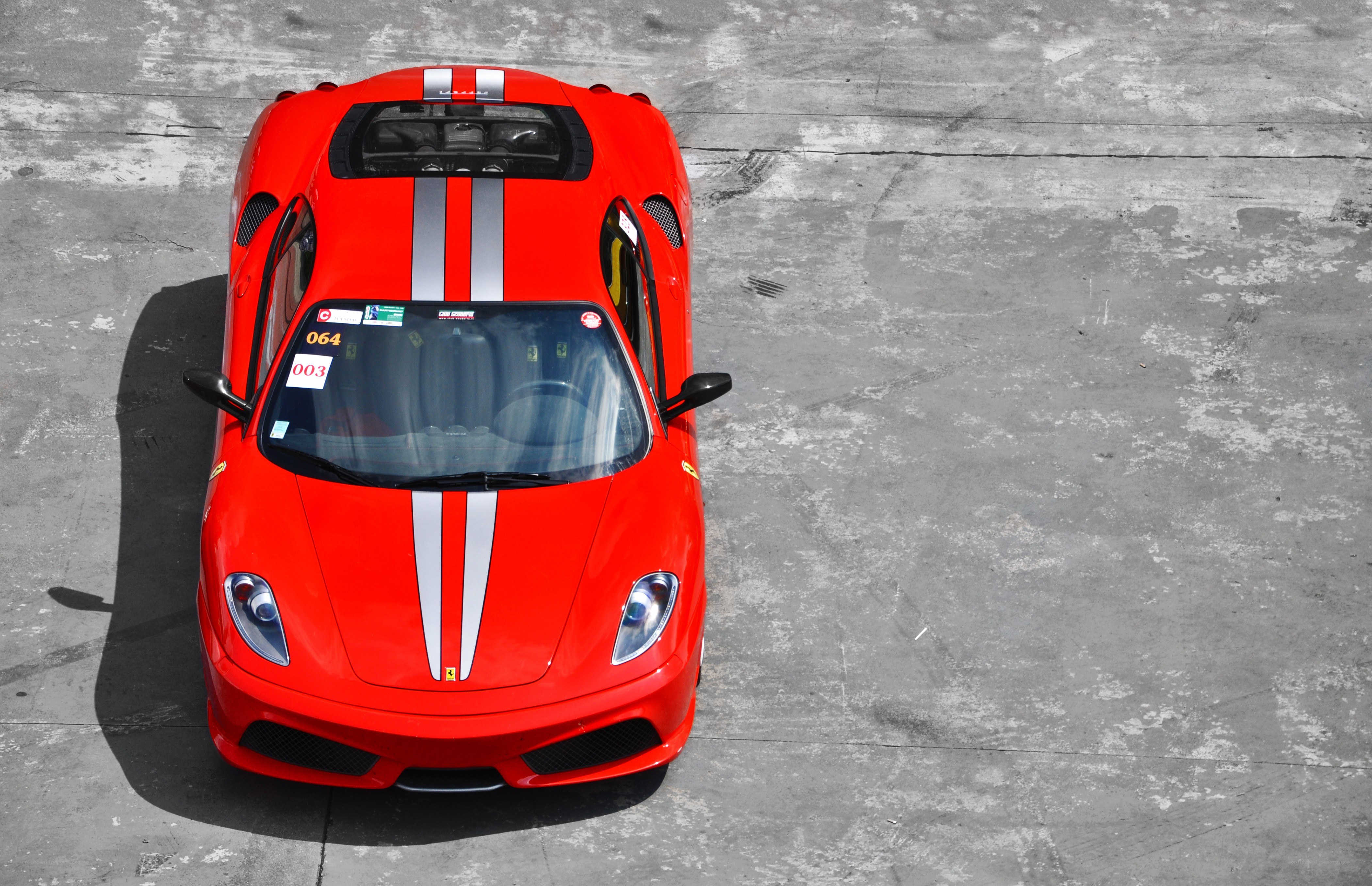 Red Ferrari with racing stripes