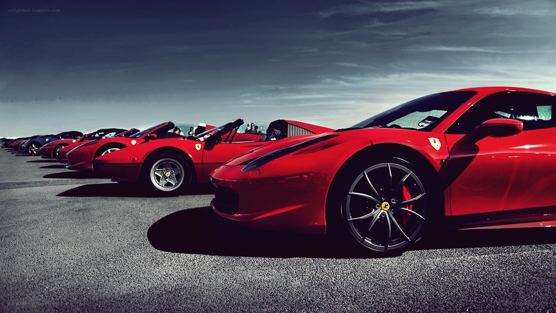 Red Ferraris in a line