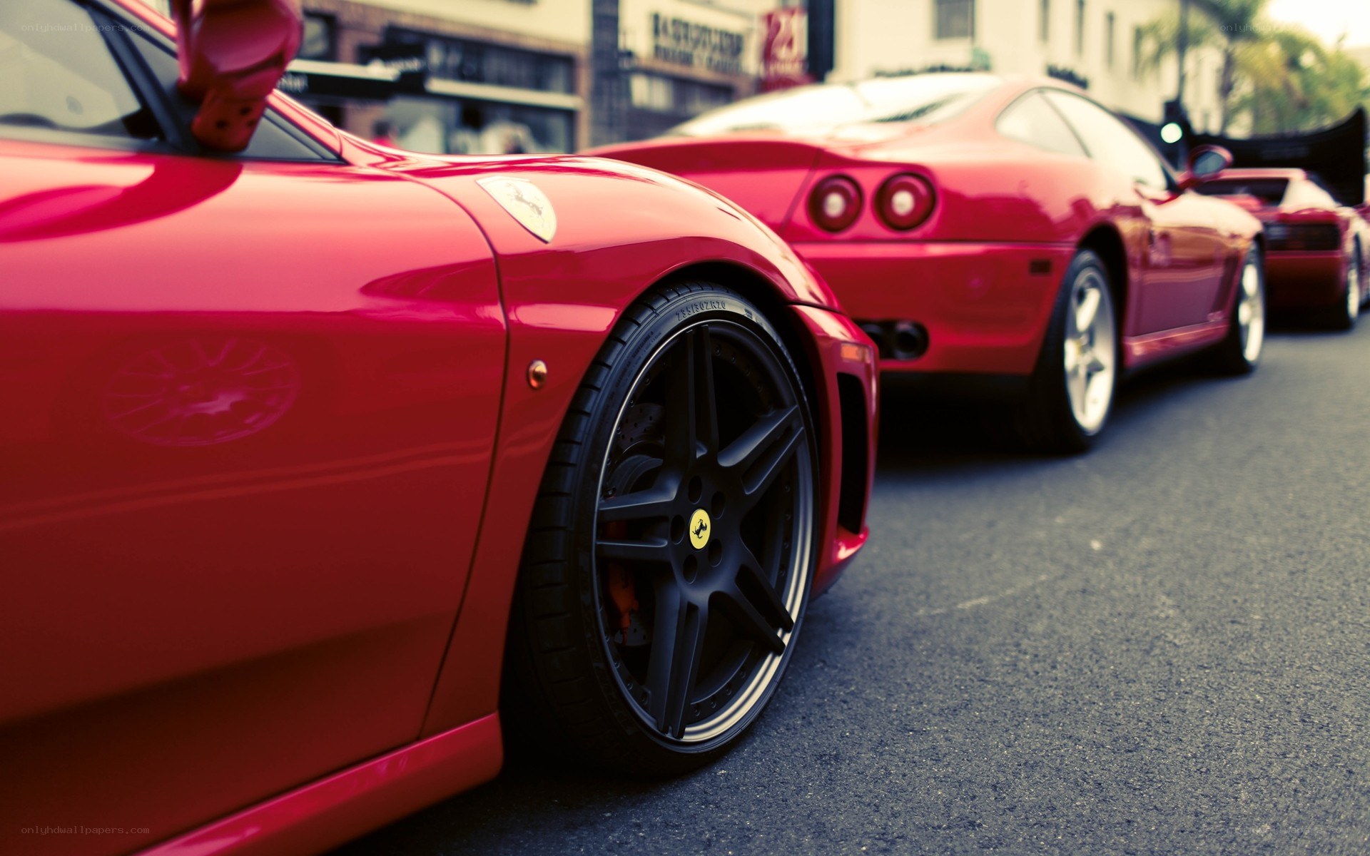 Red Ferraris in a line