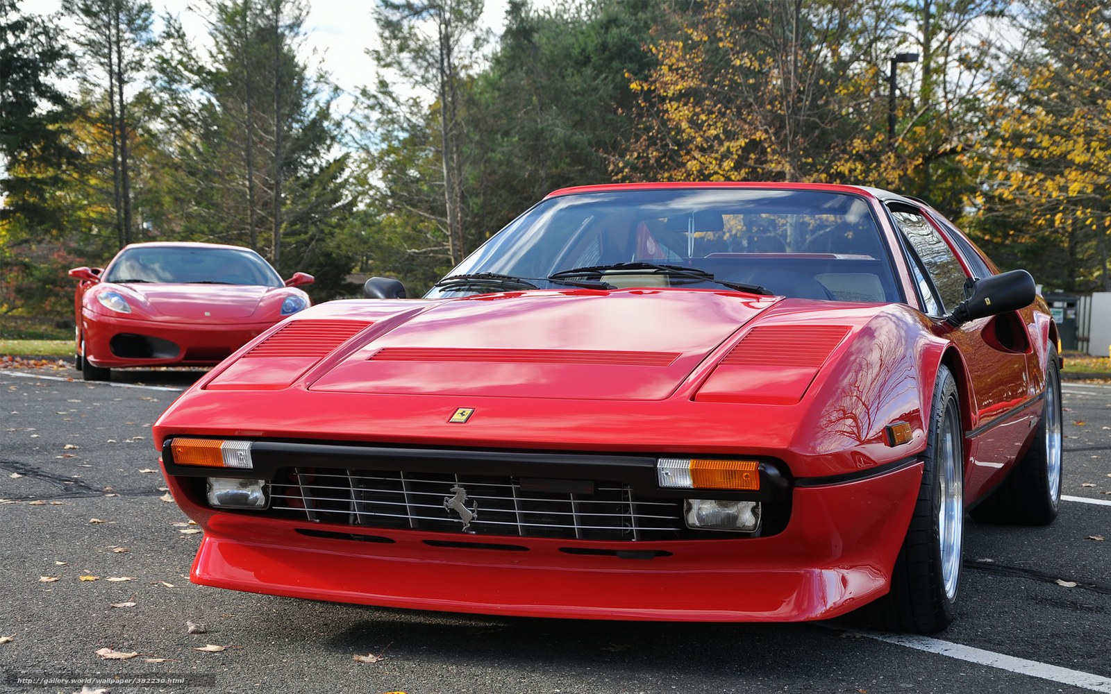 Red Ferraris in a parking lot