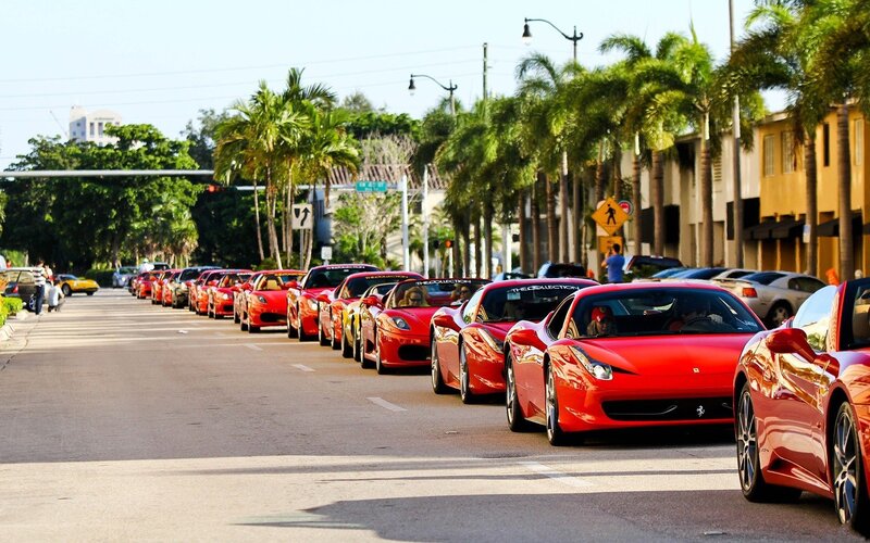 Red Ferraris on a city street