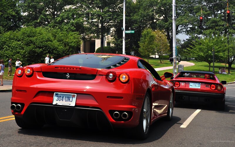 Red Ferraris on a city street