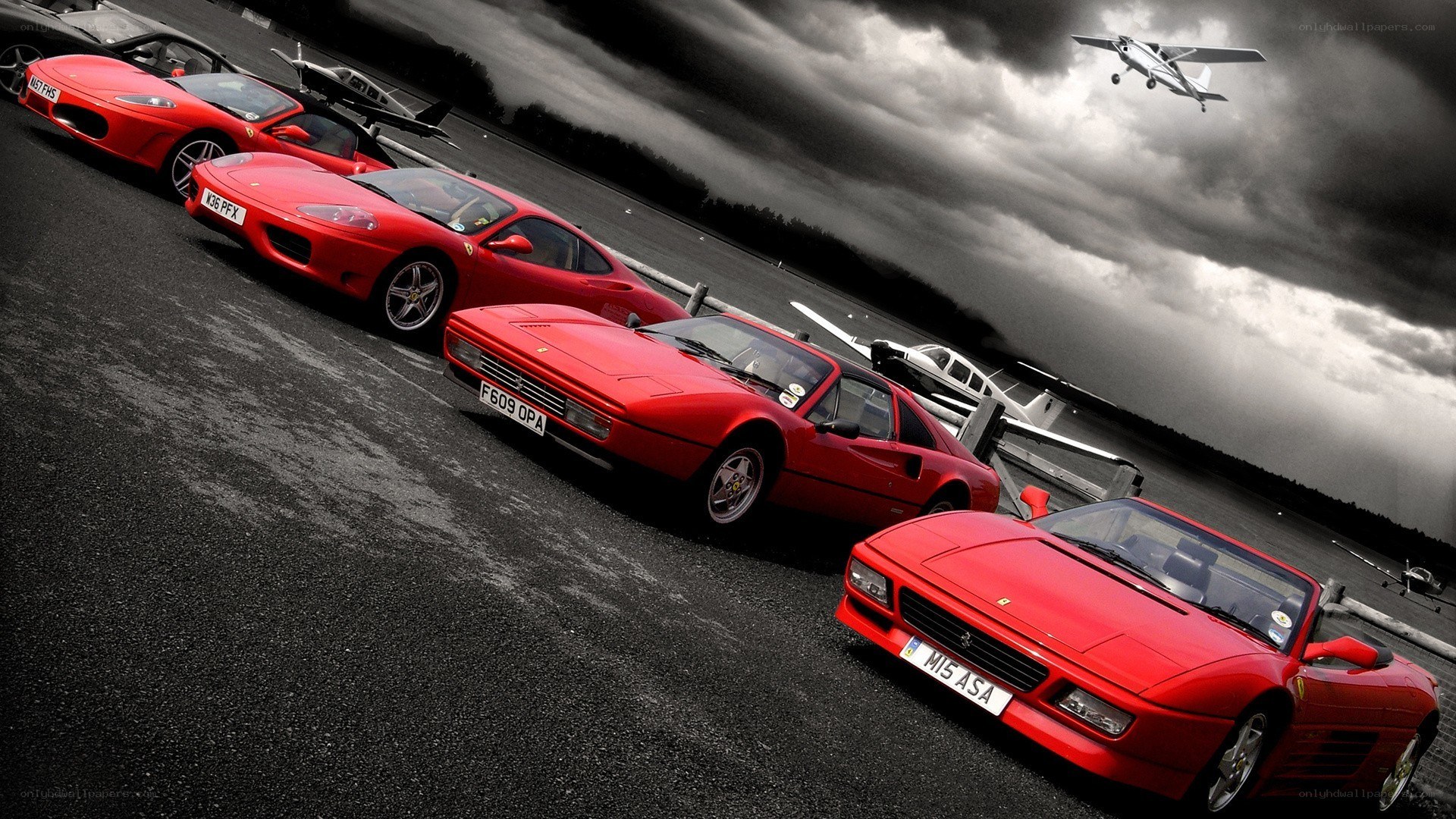 Red Ferraris on an airfield