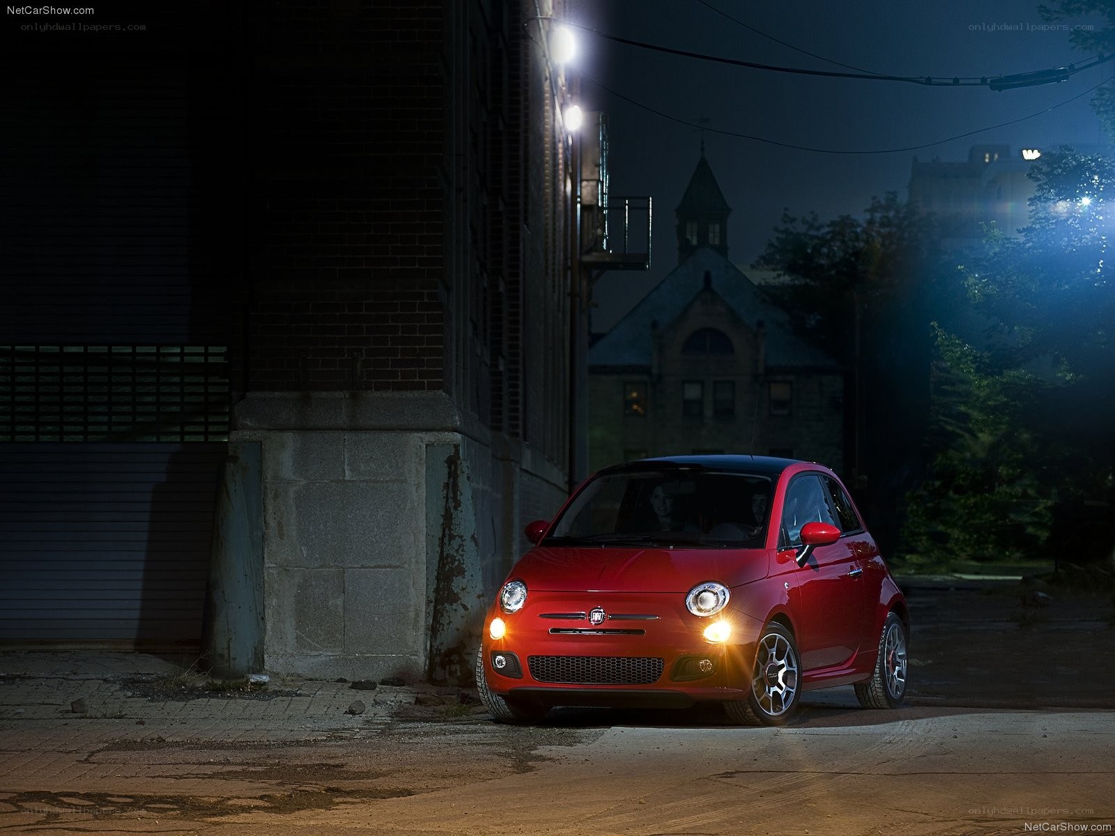 Red Fiat 500 at night