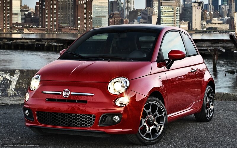 Red Fiat 500 by the water