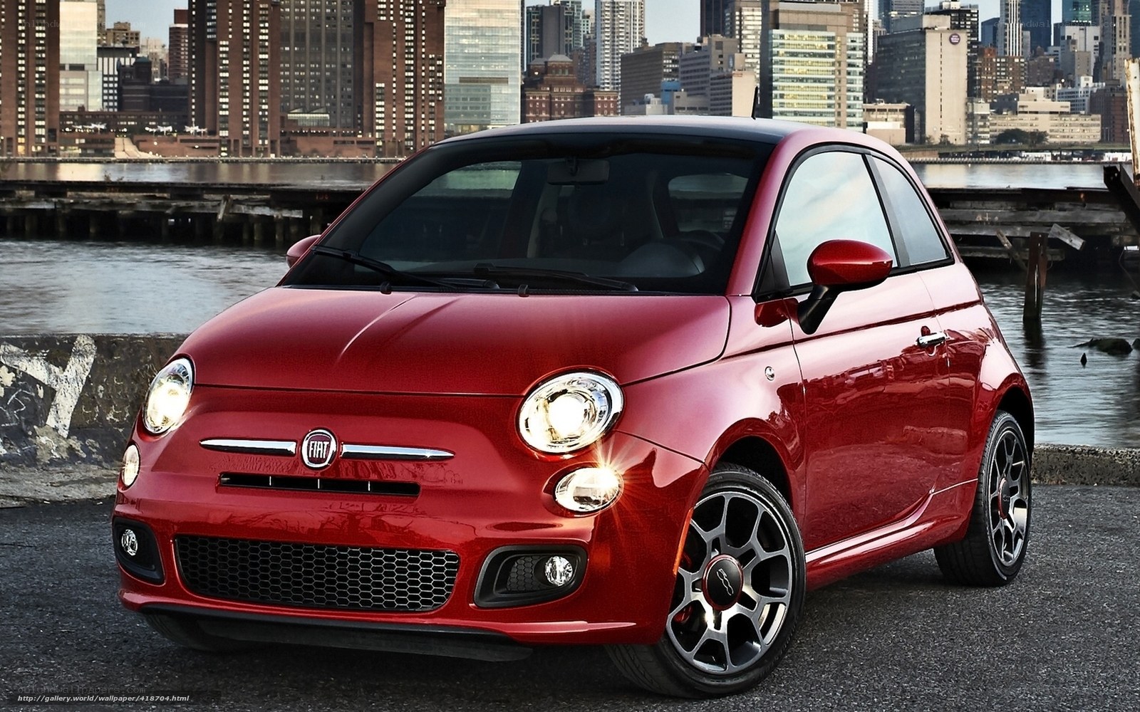 Red Fiat 500 by the water