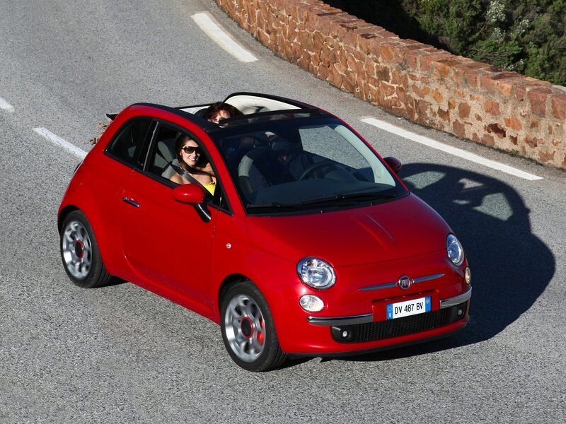 Red Fiat 500 convertible driving