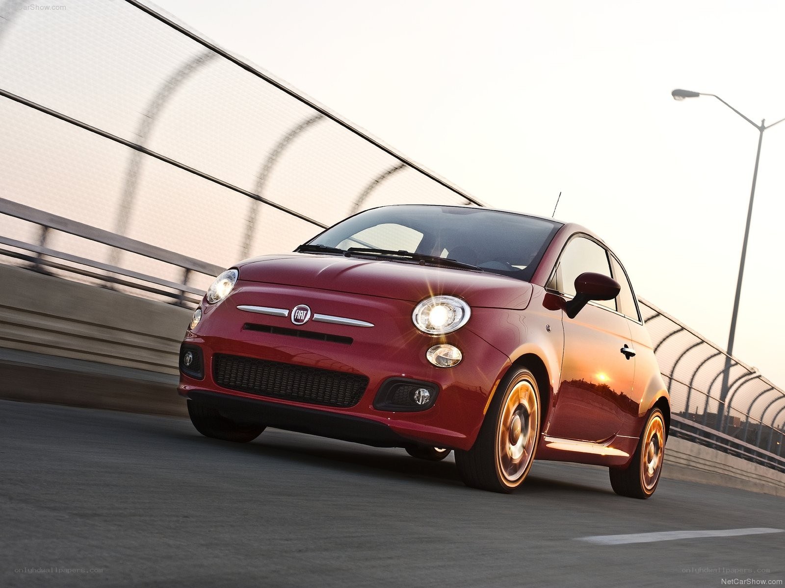 Red Fiat 500 on a bridge