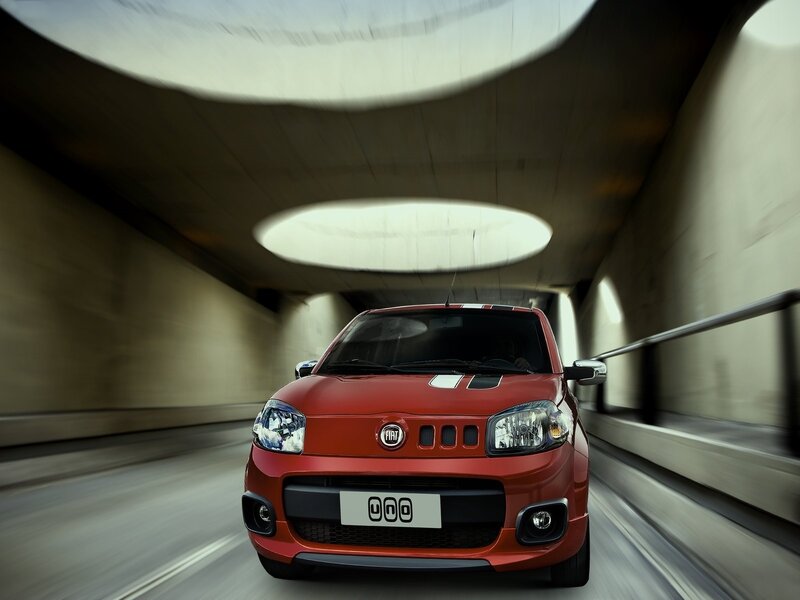 Red Fiat 500L driving in tunnel