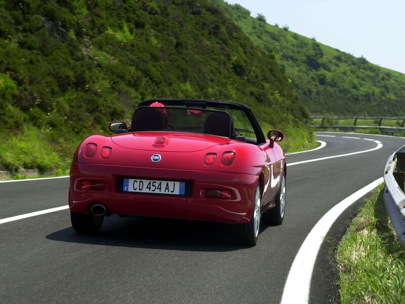 Red Fiat Barchetta on a winding road