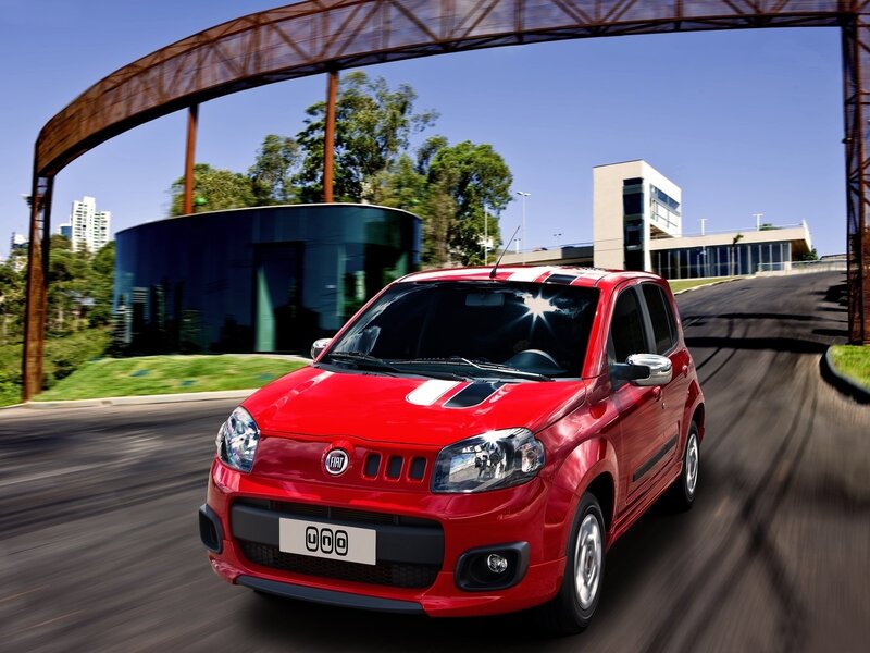 Red Fiat car on a road