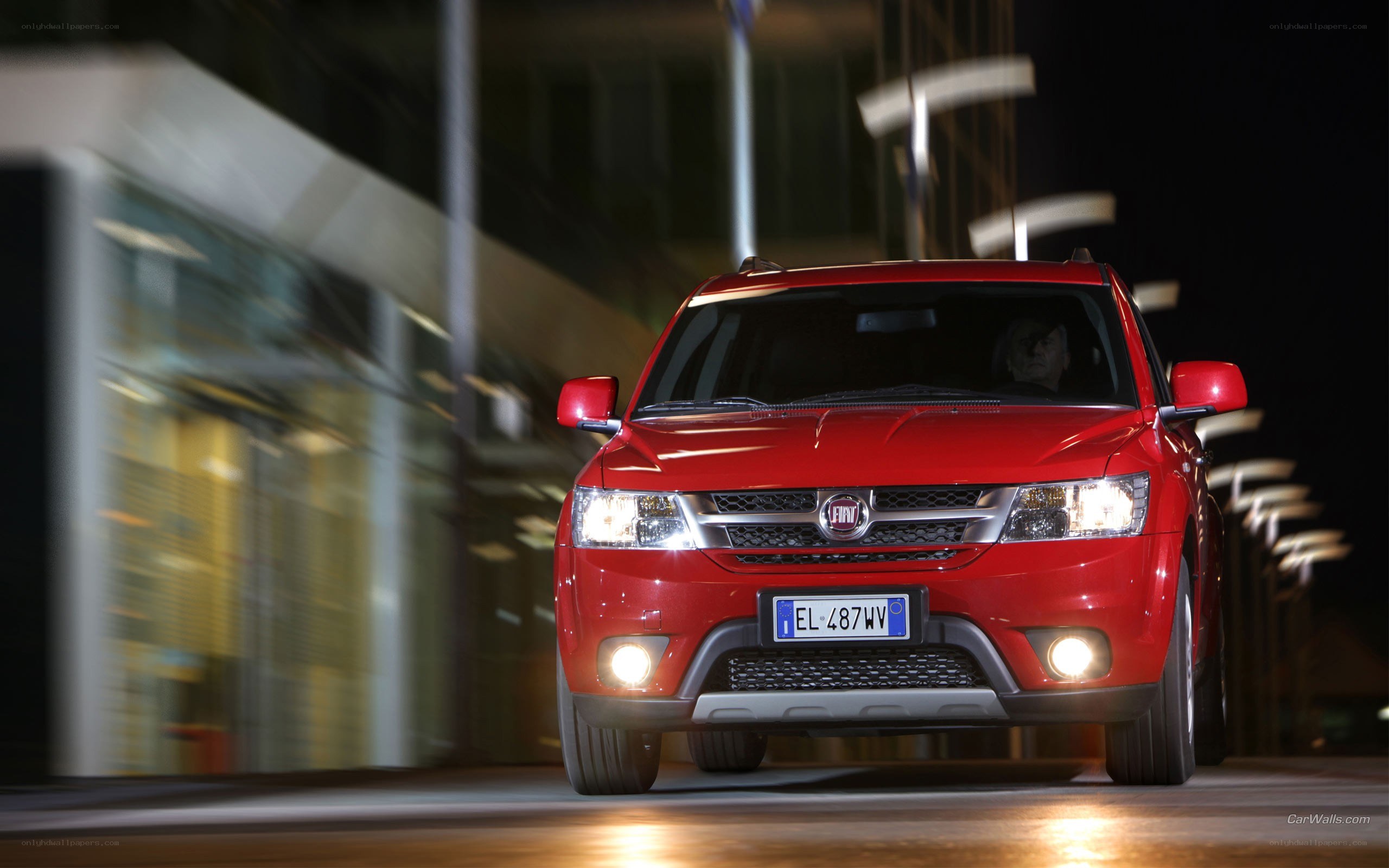 Red Fiat Compass at night