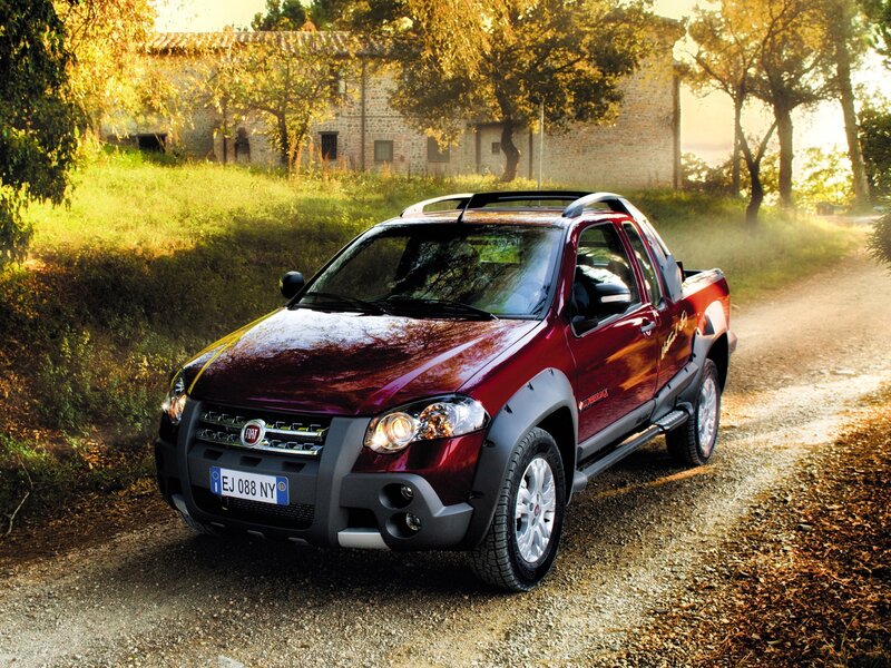 Red Fiat Doblò on a country road