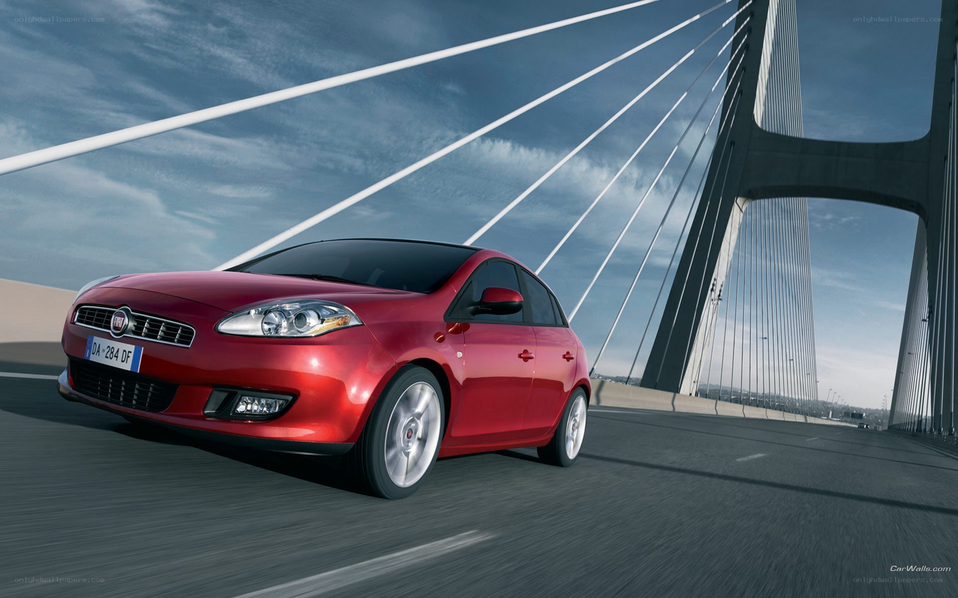 Red Fiat on a cable-stayed bridge