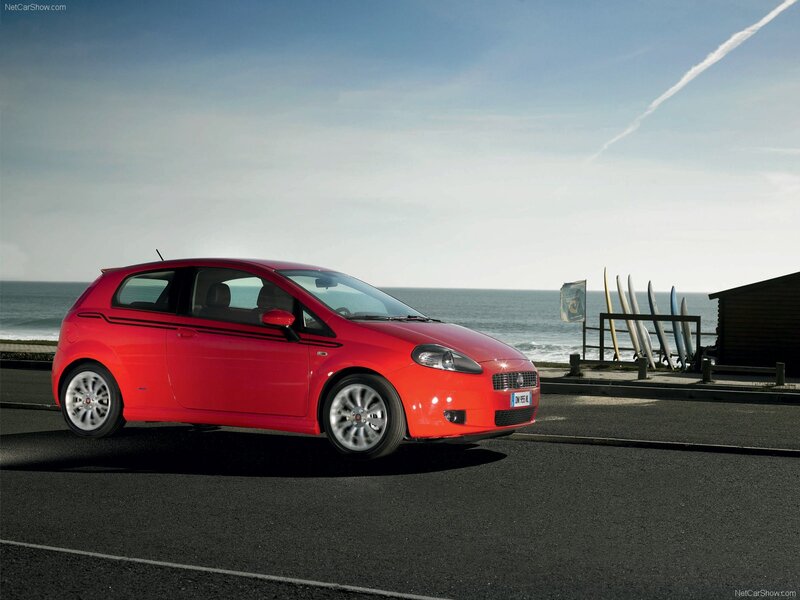 Red Fiat Punto by the sea