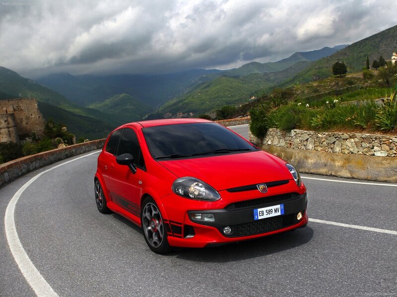 Red Fiat Punto in mountain pass