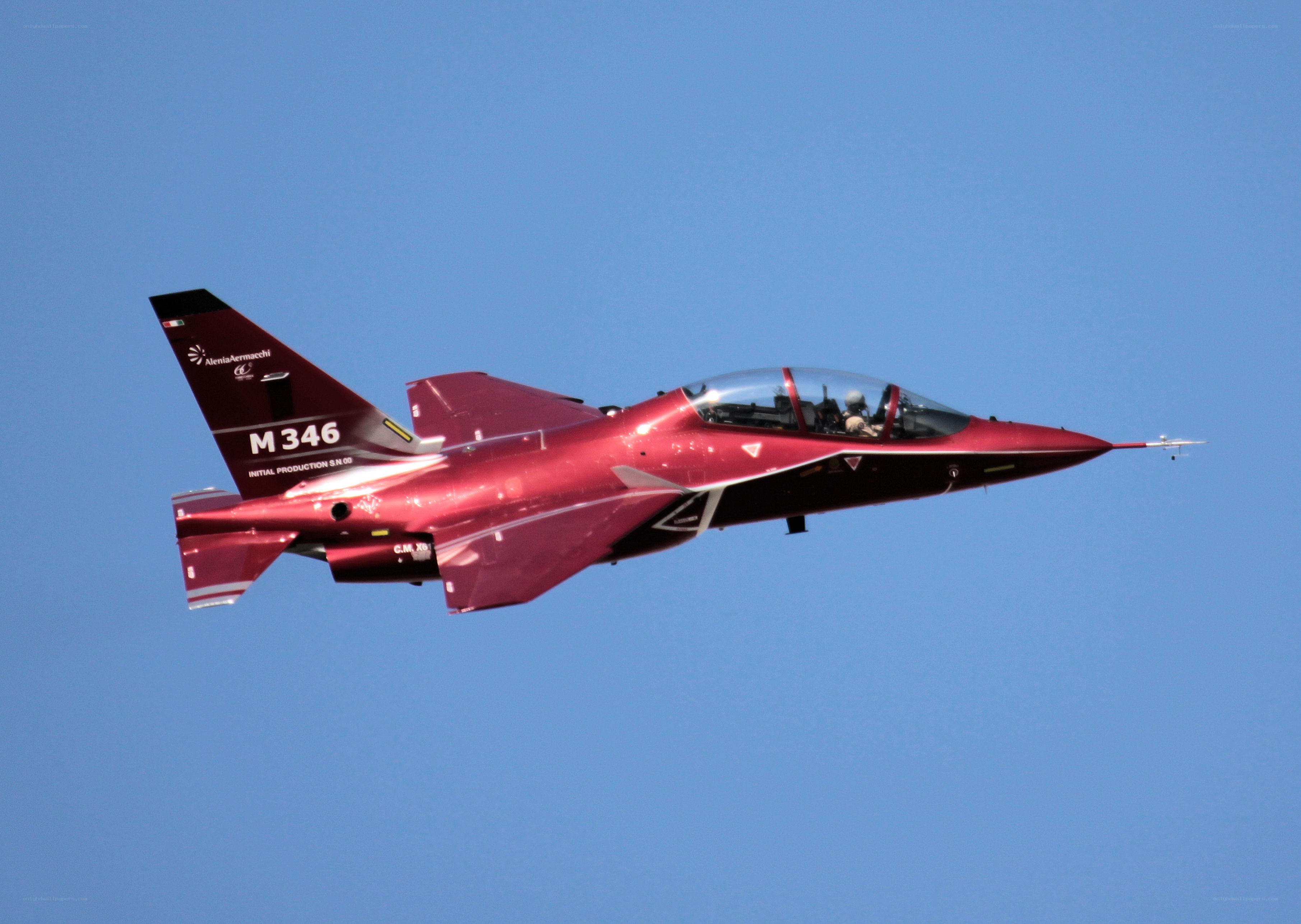 Red fighter jet in flight