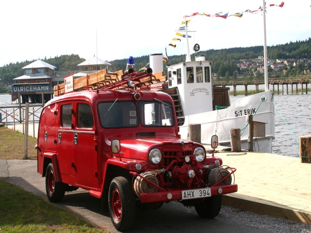 Red fire truck at a dock