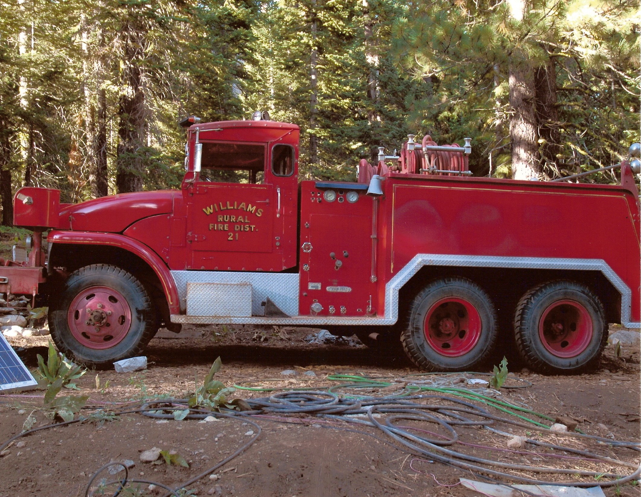 Red fire truck in forest