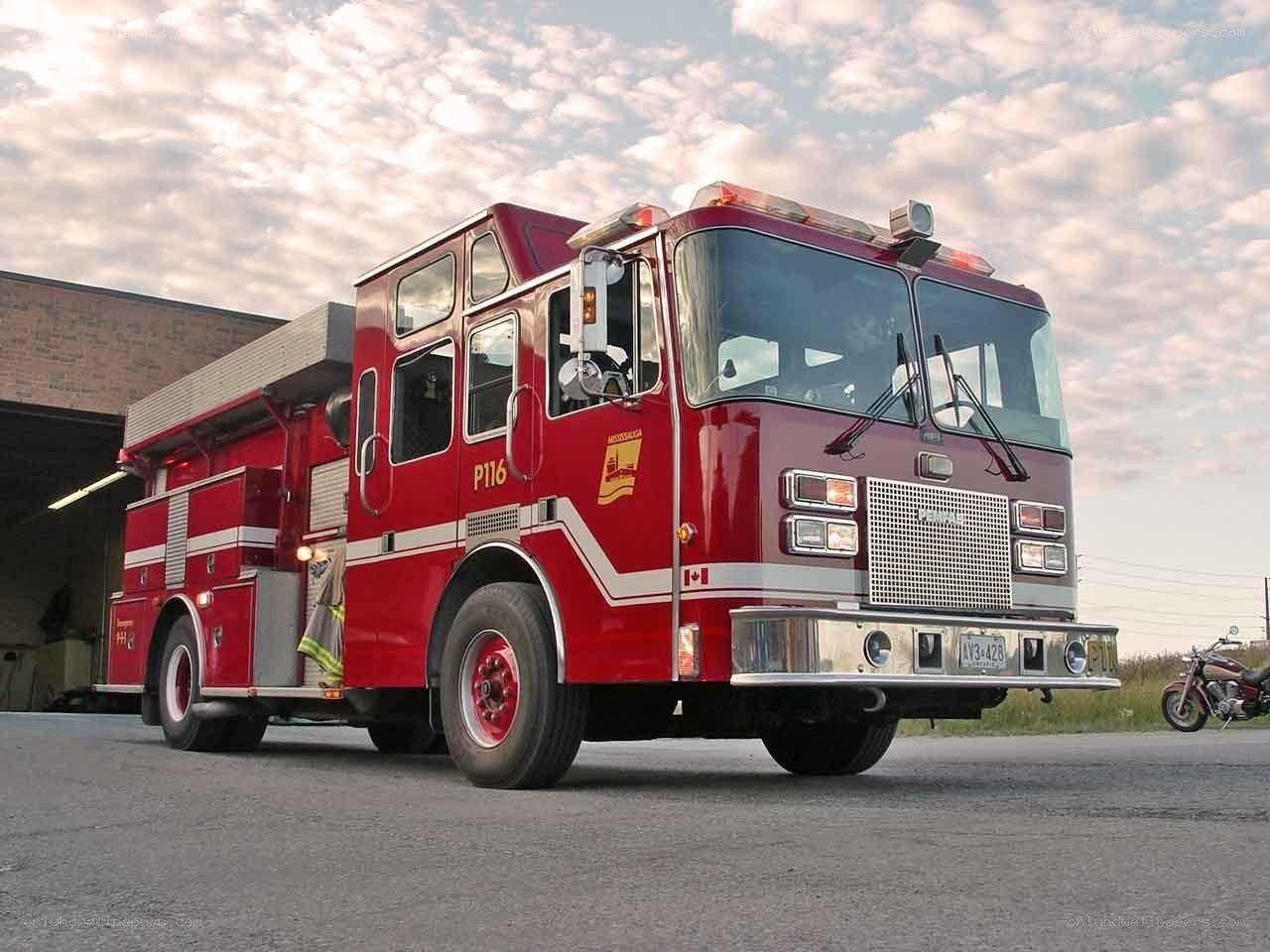Red fire truck parked outside station