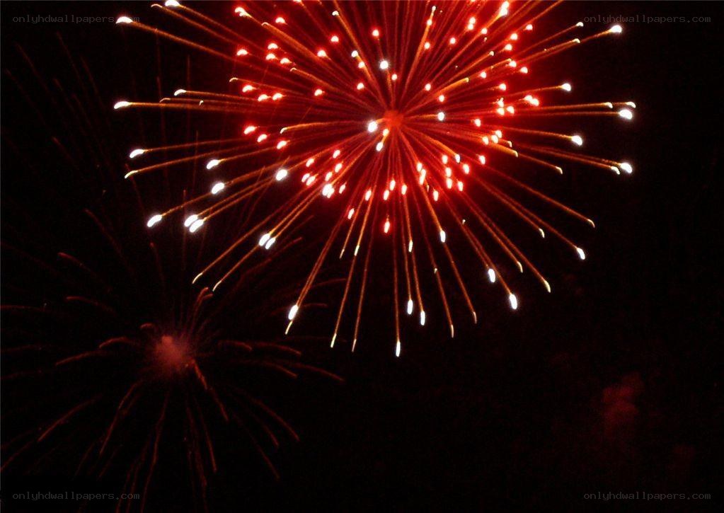 Red fireworks in night sky