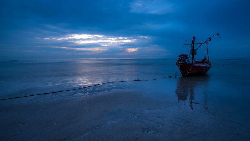 Red Fishing Boat on Beach